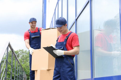 Team member assessing moving route and load safety before a van move