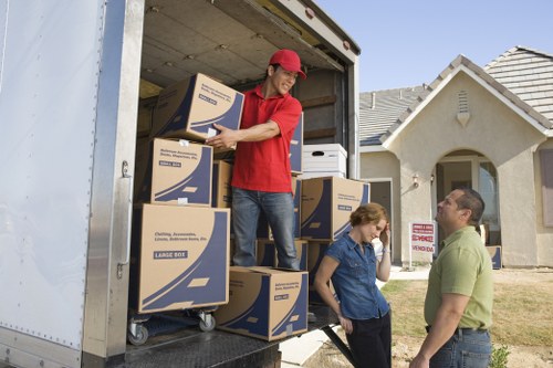 Professional movers handling furniture near Keston residential streets