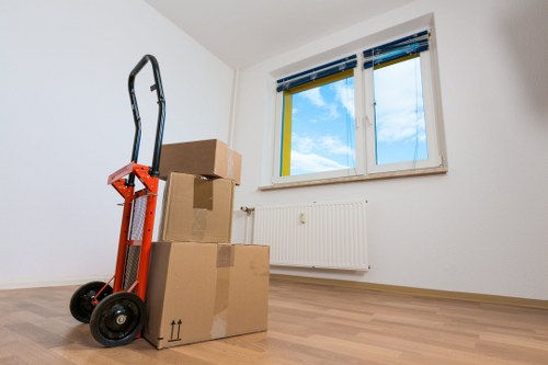 Removal van and packed household items ready for transport in Keston