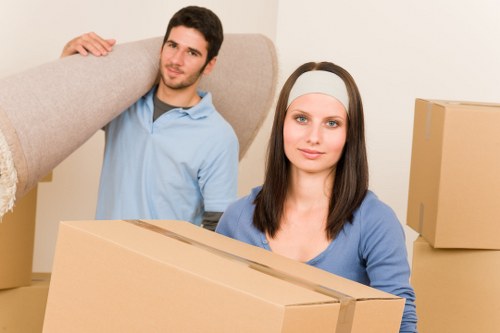 Professional removals team handling packed boxes in Keston